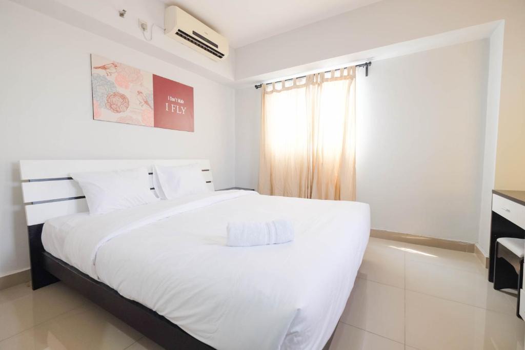 Karet Apartment | Contemporary 2BR at The Wave Apartment By Travelio