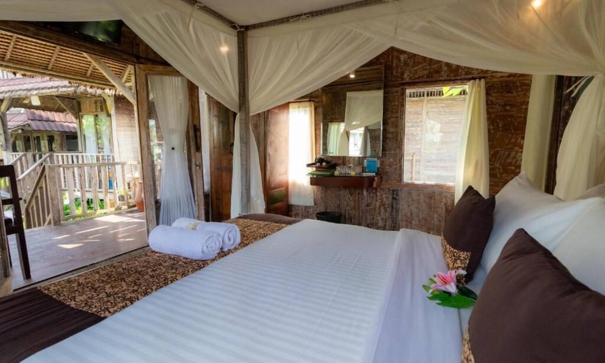 Melayang House | Deluxe room with pool view at Ubud