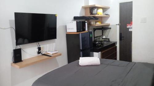 Bumi Serpong Damai Apartment | FREE WIFI, NETFLIX, SMART TV, MINERAL WATER, AMENITIES - Studio with Foldable Wall Bed at Serpong Garden Apt