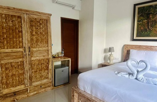 Peliatan Bed & Breakfast | Deluxe Double Room with Balcony at Mandala Home Stay