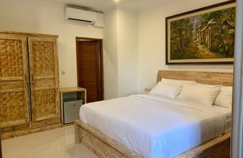Peliatan Bed & Breakfast | Deluxe Double Room with Balcony at Mandala Home Stay