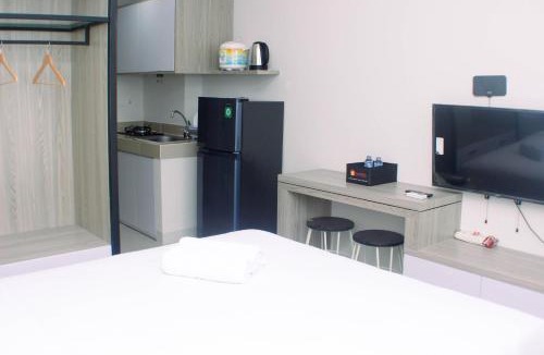 Cikarang Apartment | Homey and Minimalist Studio at Vasanta Innopark Apartment By Travelio