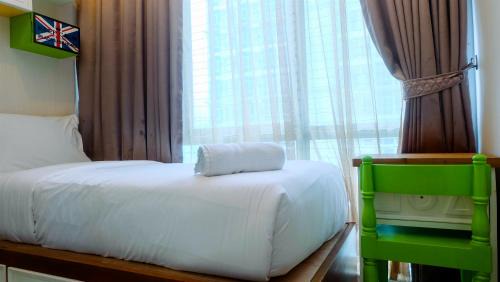 Menteng Apartment | Pool View 2BR Apartment at Capitol Park Residence By Travelio