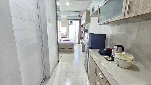 Pinang Apartment | Springwood At By LiviRooms Tangerang