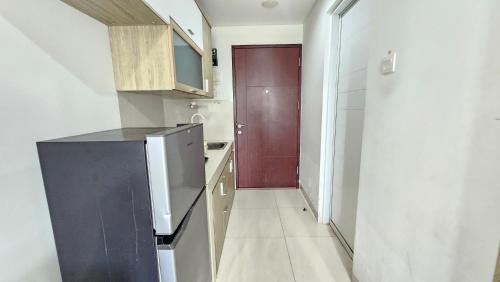 Pinang Apartment | Springwood At By LiviRooms Tangerang