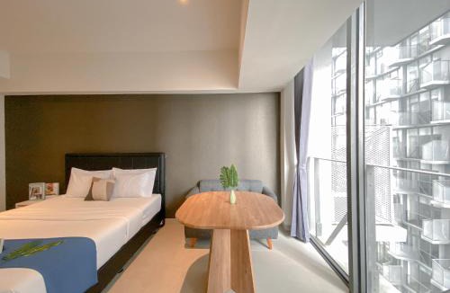 Pagedangan Apartment | Studio Apartment with Sofa at Carstensz Residence By Travelio