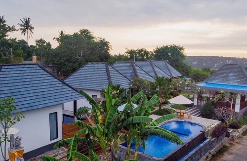 Penida Island Cottage | WK Gamat Garden by WizZeLa ( Deluxe Room )