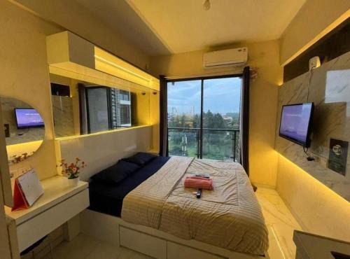 Apartemen Grand Kamala Lagoon by Cozy Room in Pekayon Satu