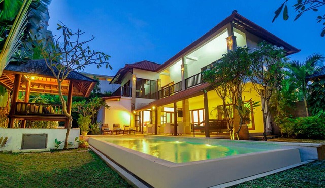 Experience Mawar Estate, a 7-bedroom private villa estate in Seminyak. Accommodates up to 14 guest, includes daily breakfast, a full-time private chef, airport transfers, complimentary massages, housekeeping, and a dedicated driver. in Seminyak