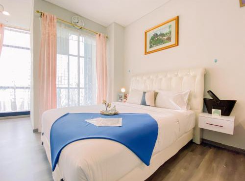Good and Simply 1BR at Sudirman Suites Apartment By Travelio