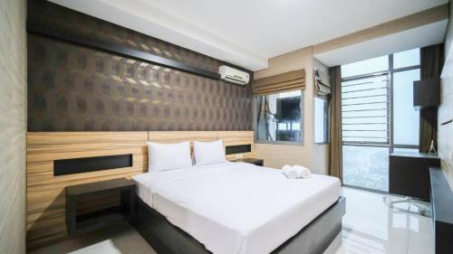 Homey and Cozy Living 2BR Apartment at Aryaduta Residence Surabaya By Travelio in Surabaya