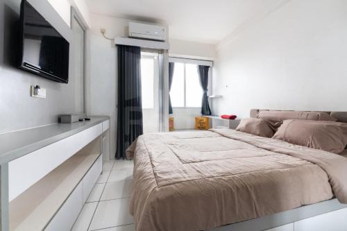RedLiving Apartemen Riverview Residence - UV Rooms Tower Mahakam with Netflix in Tegalgede