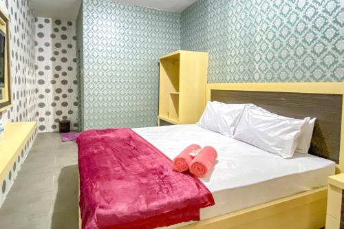 Tini's Guest House Malang Mitra RedDoorz in Betek