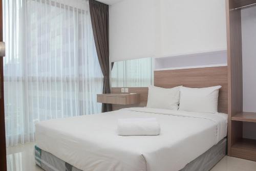Modern 1BR at Ciputra World 2 Apartment By Travelio