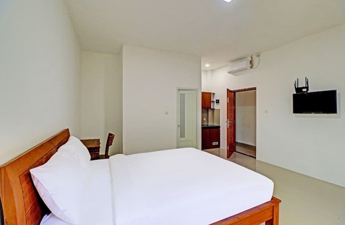 By Pass Ngurah Rai Hotel | Capital O 92039 Runways House