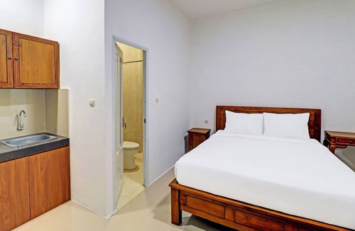 By Pass Ngurah Rai Hotel | Capital O 92039 Runways House