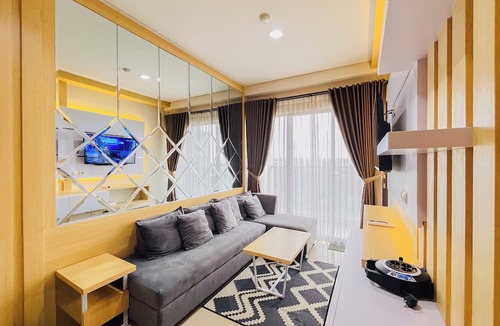 Mlati Apartment | Neat Warm Wooden Tone 1Br At Patraland Amarta Apartment
