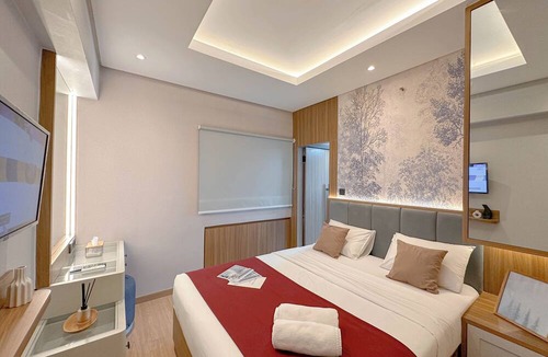 Surabaya Apartment | Modern Look With Wooden Accent 3Br At Kondominium Puncak Marina Apartment