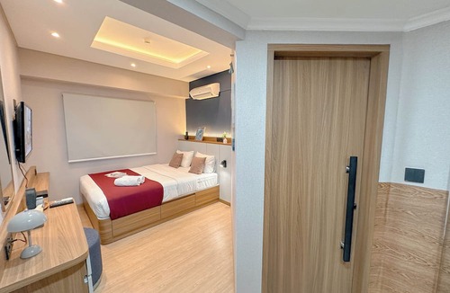 Surabaya Apartment | Modern Look With Wooden Accent 3Br At Kondominium Puncak Marina Apartment