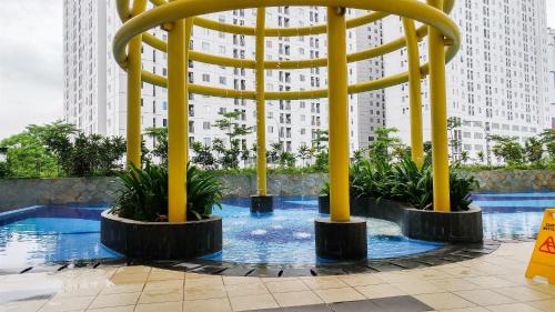 Jatinegara Apartment | Exquisite 2BR Bassura City Apartment near Shopping Mall By Travelio