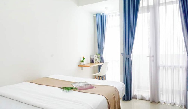 Cozy White Studio At Vasanta Innopark Apartment in Cikarang