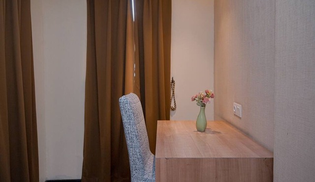 Warm and Minimalist Studio (No Kitchen) at Great Western Apartment