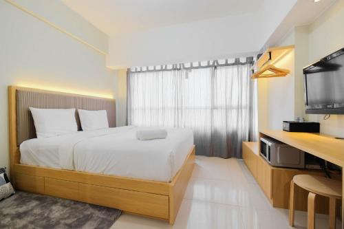 Modern Studio @ Springlake Summarecon Apartment By Travelio in Rawabugel